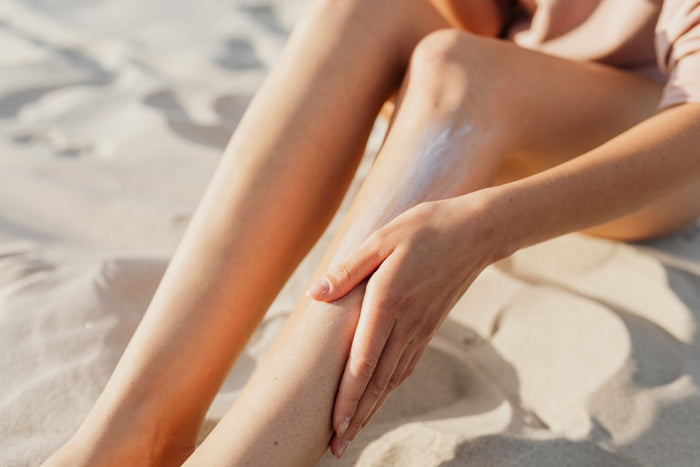 Close-up of a broad-spectrum sunscreen being applied and blended into skin