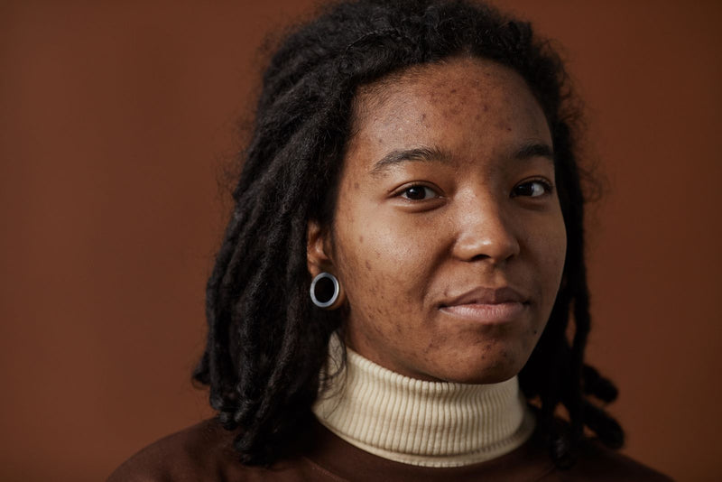 Close-up of a smiling woman with natural skin texture